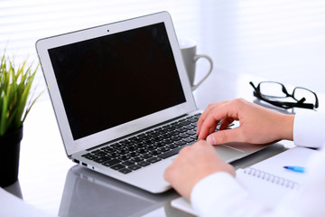 Close-up of Business woman is typing on laptop computer
