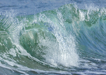 Marine, transparent waves in the coastal zone.