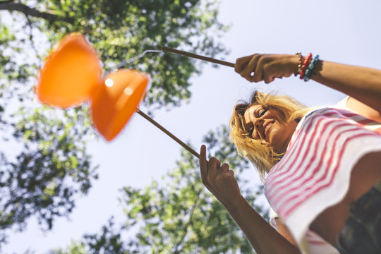 Young woman playing with diabolo toy