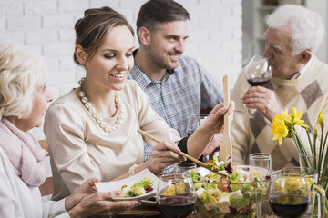 Woman with family at dinner table
