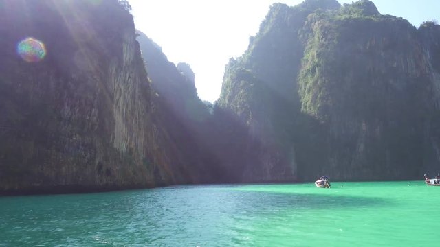 Floating on boat in bay of Phi Phi Leh island, Krabi, Thailand, pan view 4k

