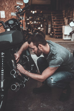 Working in his garage. 