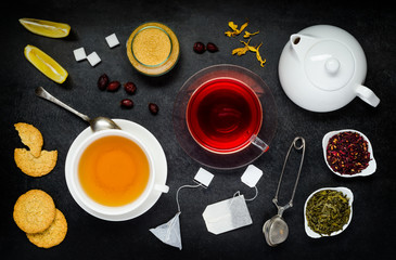Obraz na płótnie Canvas Black Tea and Red Fruit Tea with Ingredients