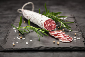 Salami on dark background