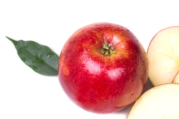 one big bright red ripe apple with green leaf