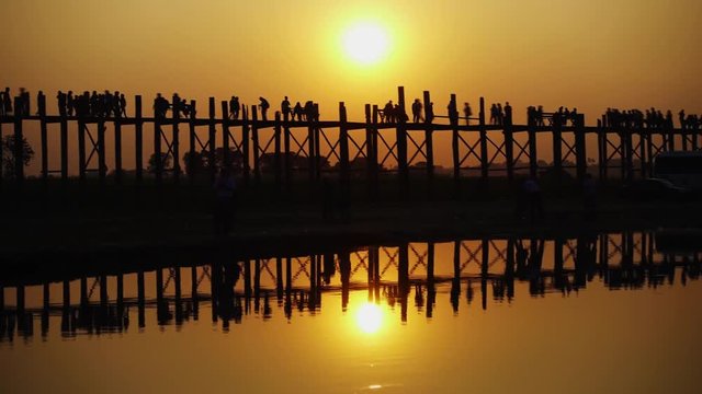 Famous U-Bein teak bridge at sunset on Taungthaman lake, Mandalay, Myanmar, timelapse 4k
