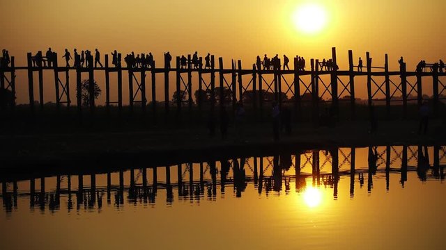 Famous U-Bein teak bridge at sunset on Taungthaman lake, Mandalay, Myanmar 4k
