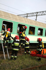 Fototapeta premium firemen in action, Firefighters exercises train accident, chemical contamination 