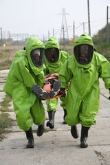Naklejka premium firemen in action, Firefighters exercises train accident, chemical contamination 