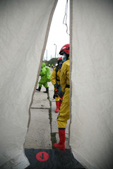Naklejka premium firemen in action, Firefighters exercises train accident, chemical contamination 