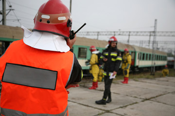 Fototapeta premium firemen in action, Firefighters exercises train accident, chemical contamination 