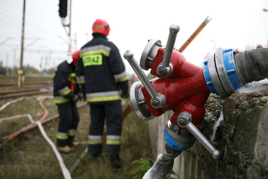 firemen in action, Firefighters exercises train accident, chemical contamination 
