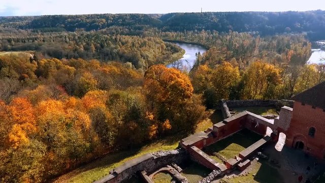 Ruins of Turaida castle on springtime, flying beetwen the towers Sigulda, Latvia