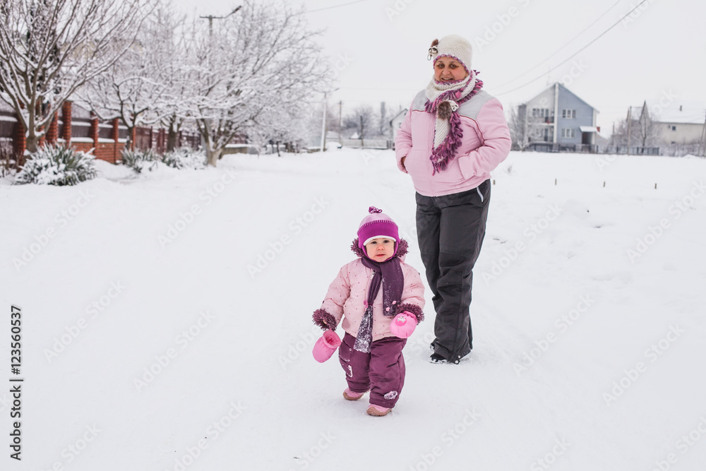 Poster Grandmother with granddaughter for a walk