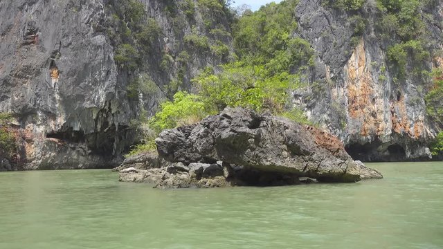 Kayaking between the rocks and caves in Thailand 4k
