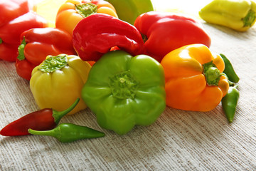 Fresh peppers on wooden table