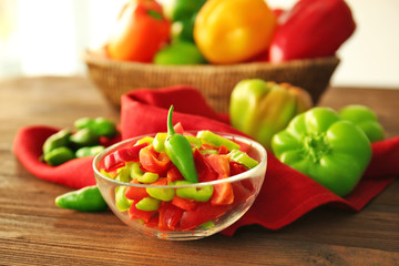 Fresh peppers on wooden table