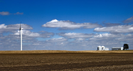 Fototapeta na wymiar Windmill on farmland