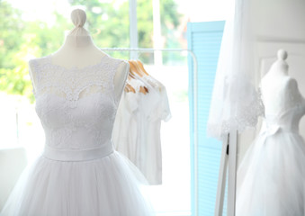 Fototapeta na wymiar Made-up wedding dress on mannequin
