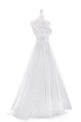 Made-up wedding dress on mannequin against white background