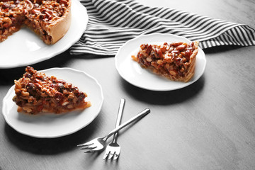 Delicious cake with nuts on table