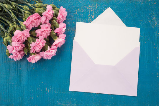 Carnations flowers and envelope
