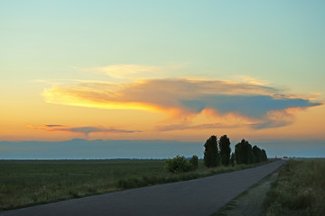 Countryside landscape with sunset sky background