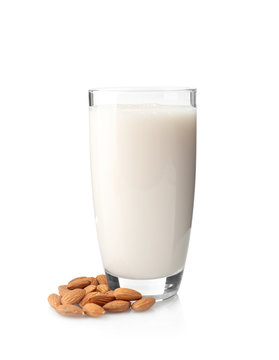 Glass of almond milk isolated on white