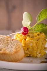ingle portion of scrambled eggs with nice small radish