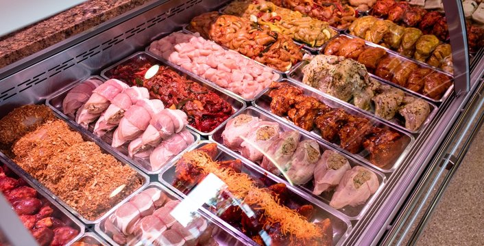 Variety of marinated meat at display counter