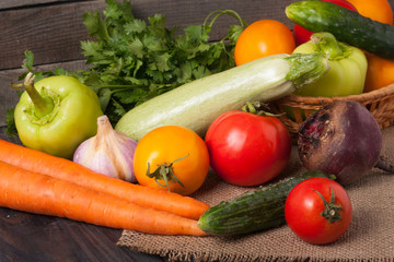 harvest of vegetables on a wooden background