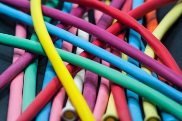 Not Inflated Multicolor Air Balloons.
Not Inflated Multicolor Air Balloons, on black background