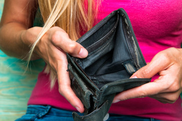 Girl holding empty wallet
