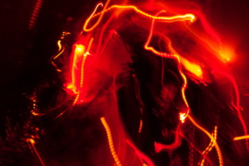 Chaotic lights in moriol blur out of focus - abstract photograph background.