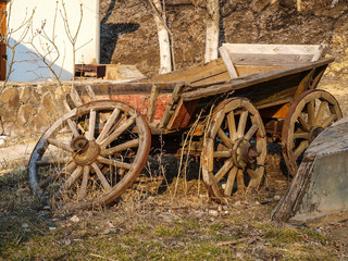 Old wagon and boat beautifully destroyed on the outskirts of the infield