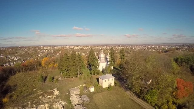 Aerial view of a church in the woods