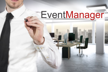 businessman in modern office writing event manager