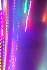Chaotic lights in moriol blur out of focus - abstract photograph background.