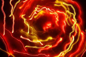 Chaotic lights in moriol blur out of focus - abstract photograph background.