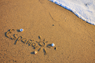 Spain sign on the sand beach