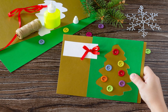 The child create Christmas greeting cards paper festive fir in C