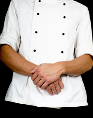 Professional chef with a hand gesture towards, wearing a chefs j