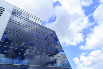 Bottom view of modern skyscrapers in business district against c