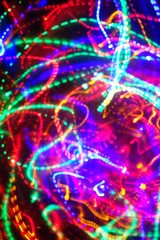 Chaotic lights in moriol blur out of focus - abstract photograph background.