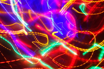 Chaotic lights in moriol blur out of focus - abstract photograph background.