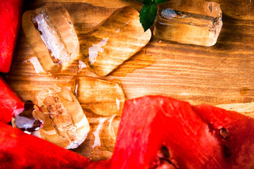 Pieces of watermelon on wooden background