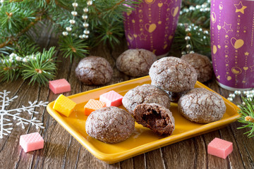 chocolate gingerbread cookies with caramel filling on a festive