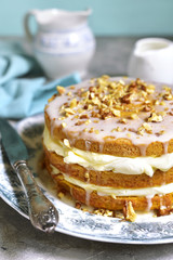 Carrot cake with mascarpone and whipped cream.