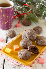Chocolate cookies with caramel filling on a festive Christmas di
