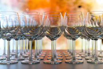 Empty Wine Glasses with stars and coloured  universe nebula on background